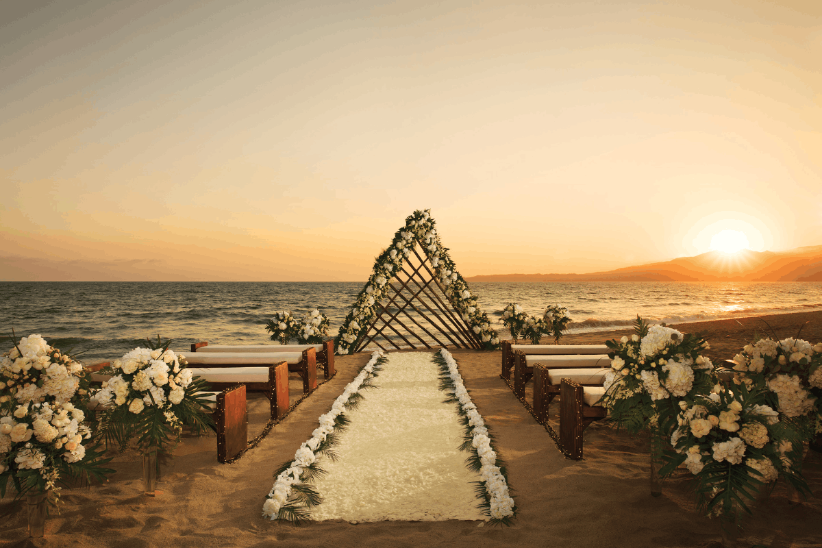 Sunset beach wedding ceremony at Krystal Grand Nuevo Vallarta.